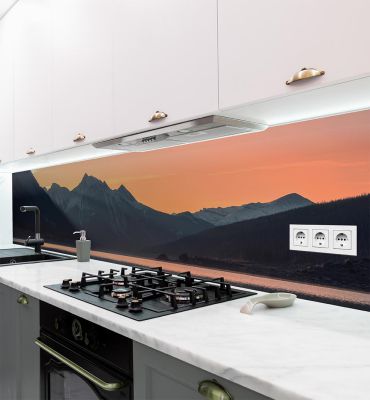 Küchenrückwand Sonnenuntergang über Bergen selbstklebend Hauptbild mit Beispiel